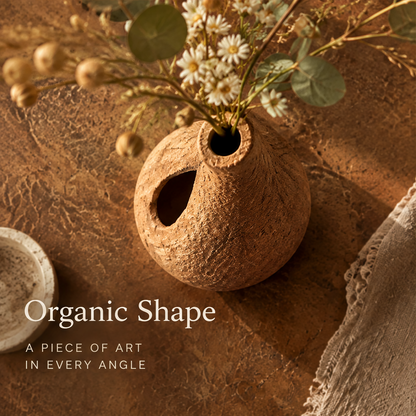Organic shape clay vase — a piece of art in every angle, shown from above on earthy surface